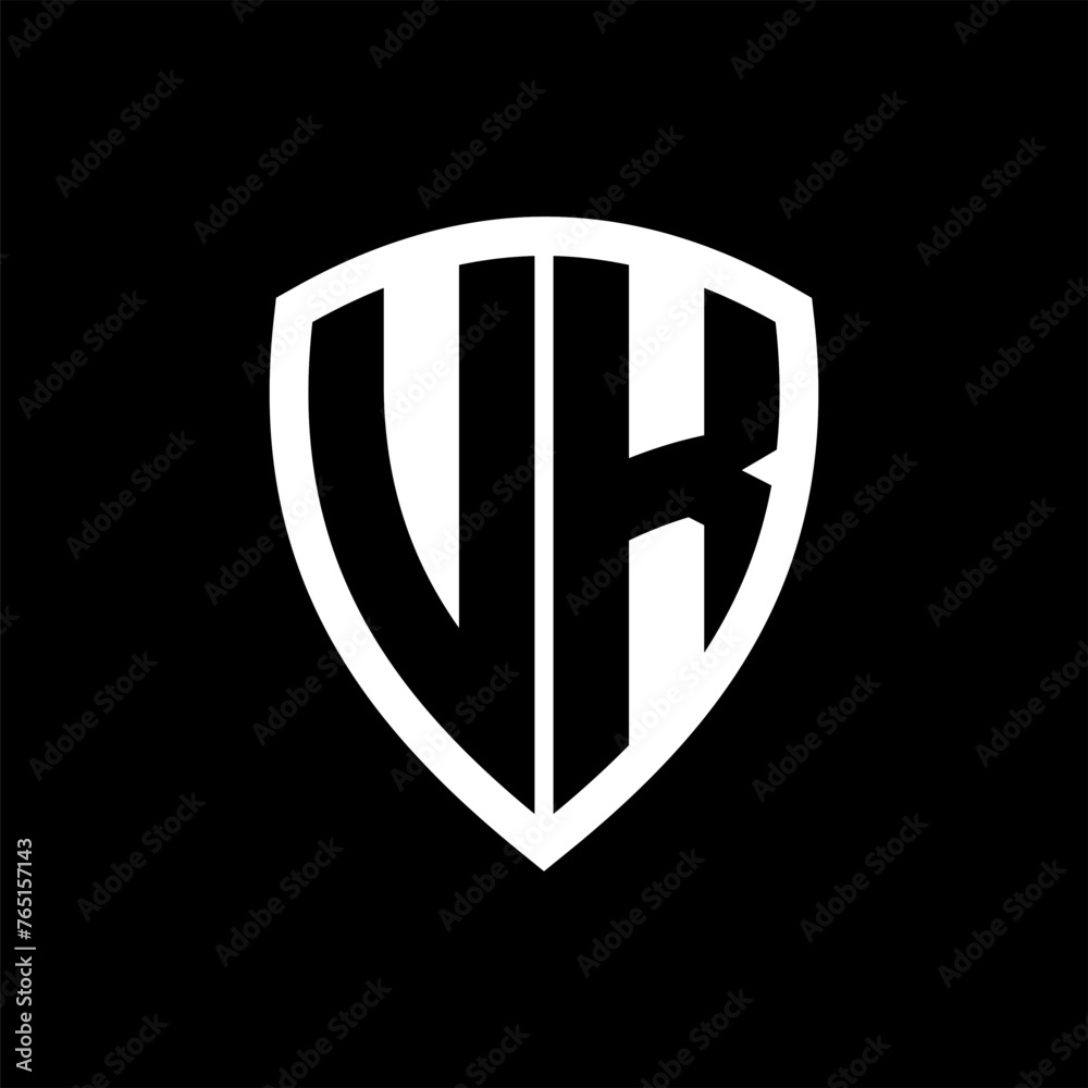 UK monogram logo with bold letters shield shape with black and white color design UK monogram logo with bold letters shield shape with black and white color design