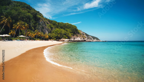 Paradisiacal beach on a summer day. Sea  mountains  sand and blue sky. Environment concept. Space for text.