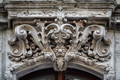 Close up of a building showcasing intricate decorative design elements, including ornamental carvings and decorative moldings