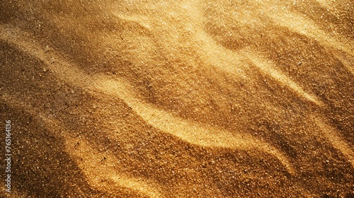Golden sand texture background. The photo was taken in the desert. The sand is very fine and has a beautiful golden color.