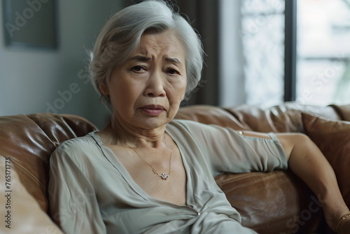 old woman have stomach pain at home