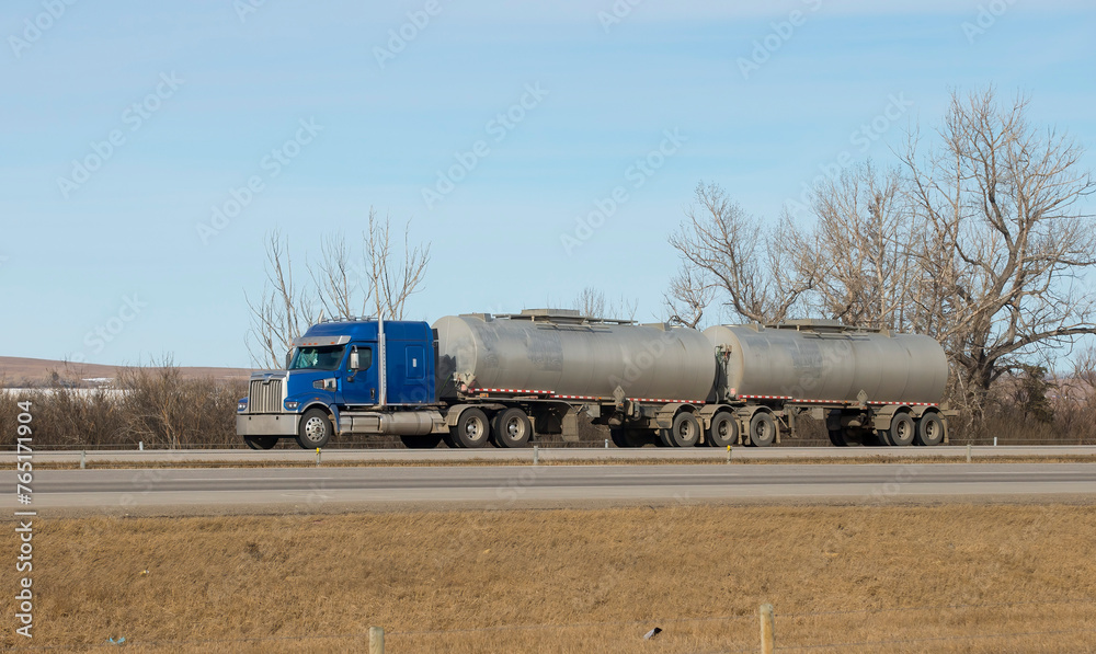 Heavy Cargo on the Road. A truck hauling freight along a highway. Taken in Alberta, Canada
