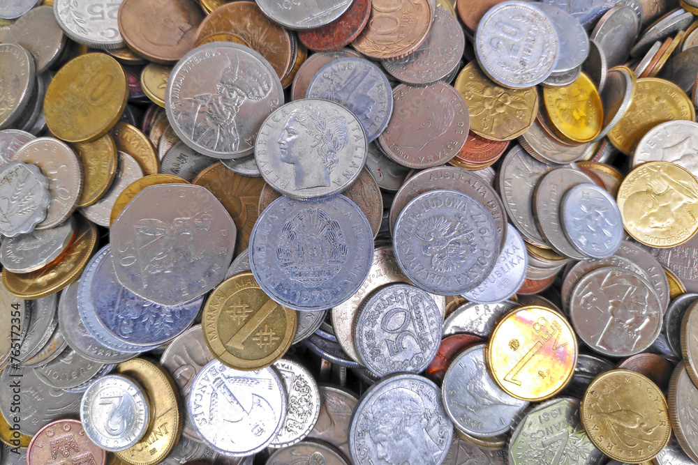Stack of old European and international coins Stack of old European and international coins