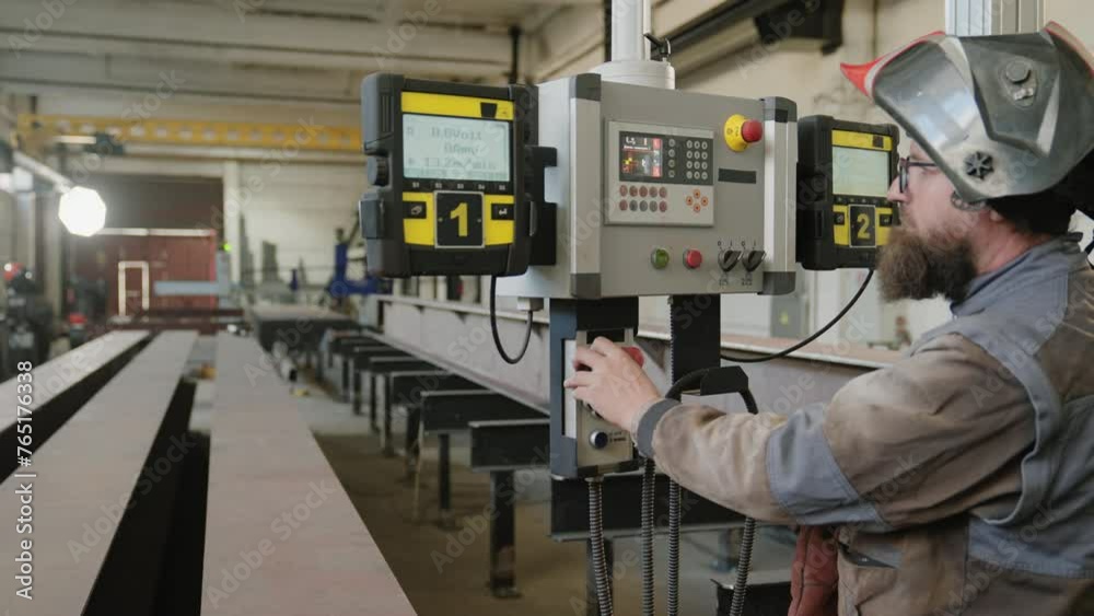 Professional heavy industrial machine the factory worker using the display to select the program to start the work modern manufacturing concept Professional heavy industrial machine the factory worker using the display to select the program to start the work modern manufacturing concept