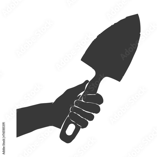 Silhouette hand holding brick trowel for construction black color only
