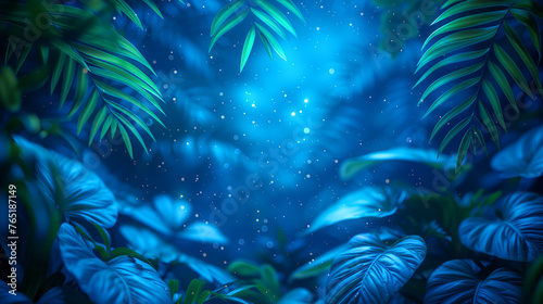 Tropical leaves against a mystical blue glow in jungle at night