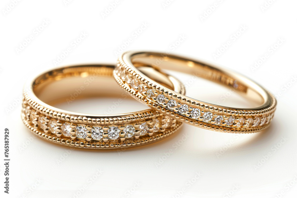 Exquisite Gold Wedding Bands Adorned with Precious Stones on a White Background, Radiating Elegance Exquisite Gold Wedding Bands Adorned with Precious Stones on a White Background, Radiating Elegance