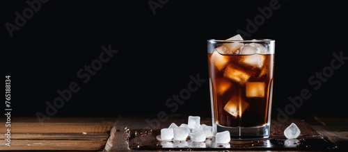 A glass of iced coffee on a wooden surface