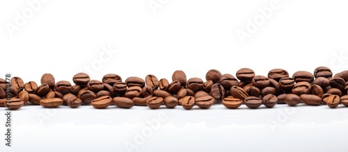 Coffee beans arranged in a close-up on a white surface