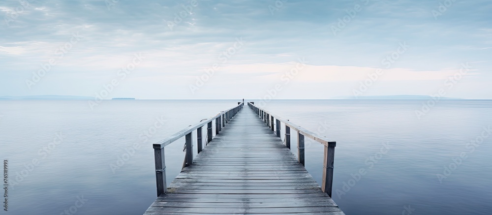Wooden jetty in the sea with distant boat - obrazy, fototapety, plakaty 
