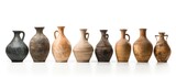 Row of ancient pottery vases on white surface