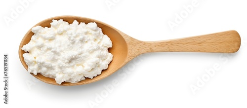 Close-up of cottage cheese in a wooden spoon