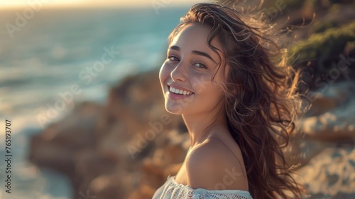 A beautiful young woman with a happy expression on her face turns her head to the sides and shows