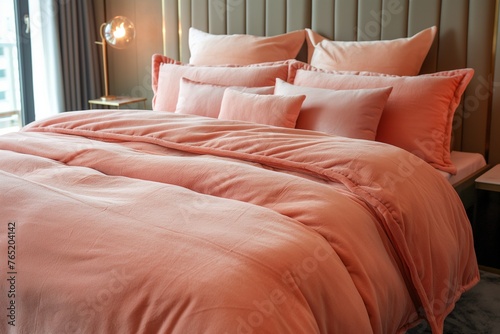 A cozy bedroom with a bed dressed in soft peach fuzz, a bedroom with cool decoration, a bedroom interior, a bedroom and decorative bed, comfortable bedroom and bed