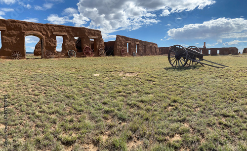Fort Union National Monument in New Mexico. Preserves fort's adobe ruins along Santa Fe Trail. Remnants of Fort Union Depot Mechanic's Corral with wagons and wagon wheels.  photo