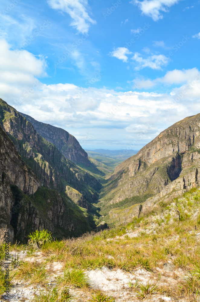 Naklejka premium Huge canyon formed by very high vertical walls, inside it runs a river that forms some waterfalls. It is located in Serra do Cipó, Brazil