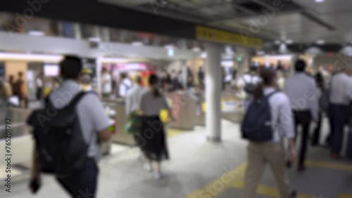 Blurred Business People and Salarymen in Suits and Dress Shirts at Tokyo Train Station in Hurry During Rush Hour