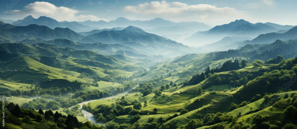 Panoramic view of the mountains and the river in the clouds
