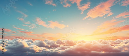 A serene view capturing a sunset over a sky filled with fluffy clouds while a plane flies in the distance