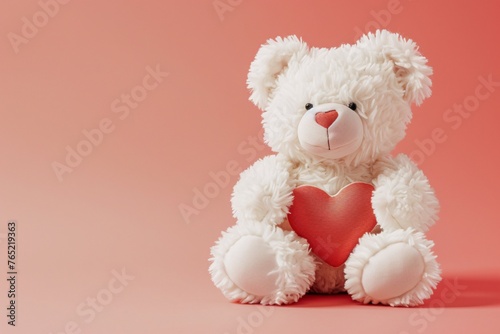 a white teddy bear holding a heart