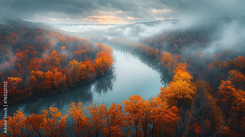 Foggy day aerial view of river with trees surrounded by misty atmosphere