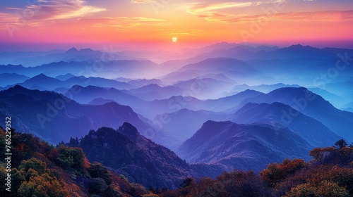 Colorful sunset illuminating clouds over mountain range