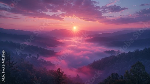 Sun sets over foggy valley with trees, creating purple afterglow in sky