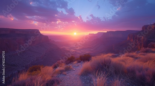 Cumulus clouds fill the sky as the sun sets over the desert canyon