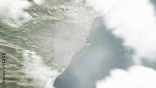 Earth zoom in from space to Comodoro Rivadavia, Argentina. Followed by zoom out through clouds and atmosphere into space. Satellite view. Travel intro. Images from NASA photo