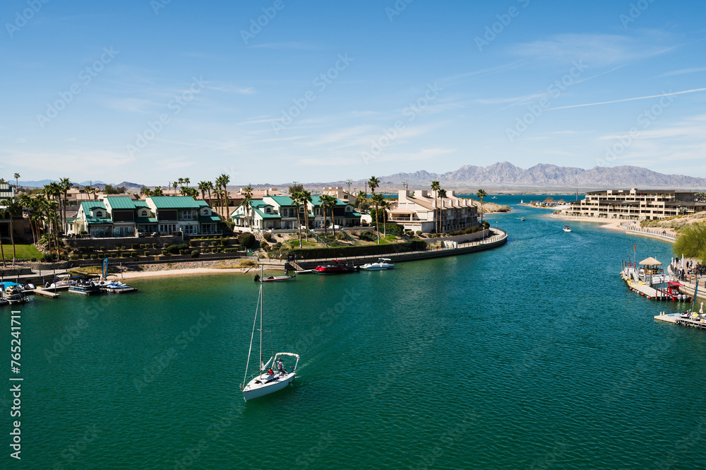 A sail boat sails under the old London Bridge, which was relocated from London England in the 1970’s to Lake Havasu Arizona.