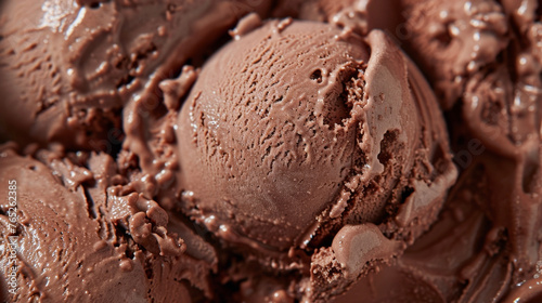 A detailed close-up of rich chocolate ice cream filling a white bowl, showcasing its creamy texture and delicious appearance.