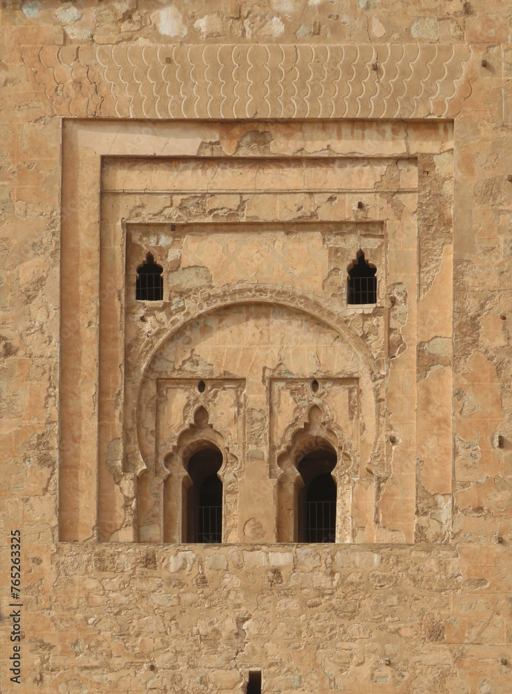 Minaret of the Koutoubia Mosque in the historic city of Marrakech (11th century). Morocco. 
Detail of decoration and windows of the south facade. UNESCO World Heritage. 