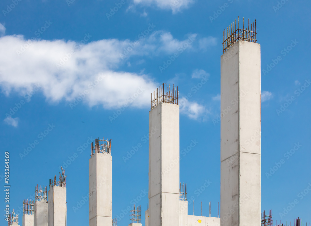 Poured concrete pillars in a high rise construction project showing rebar reinforcing steel
Poured concrete pillars in a high rise construction project showing rebar reinforcing steel