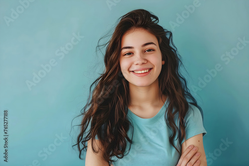 Confident young woman with charming smile on clean background. Positive human expressions 