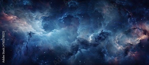 An image featuring a celestial scene of a dark blue and purple nebula filled with stars in the background