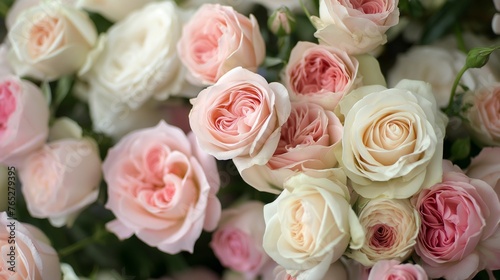 A romantic blend of blush pink and ivory roses  delicately arranged for a special celebration