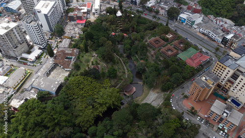 Aerial view of the city of Armenia, Quindío, Colombia. Buildings in the city of Armenia between trees. Park of life in Armenia, Quindío