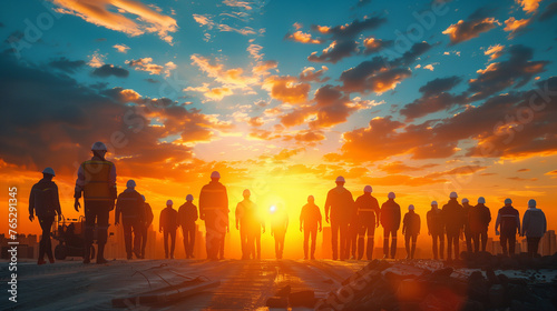 A diverse group of people stand together, their silhouettes outlined against the vivid colors of a breathtaking sunset, embracing each others presence with a sense of unity