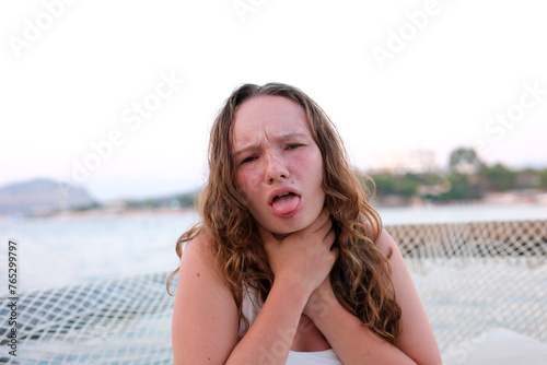Insurance company is important Sore throat girl holding her throat catching a cold in the summer at sea 