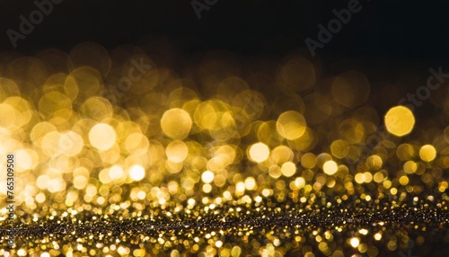 abstract bokeh background black with gold glare