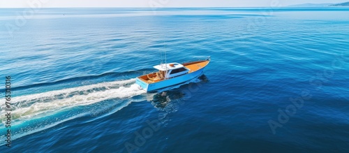 An image of a boat smoothly sailing on the water, leaving a visible wake or trail behind it.