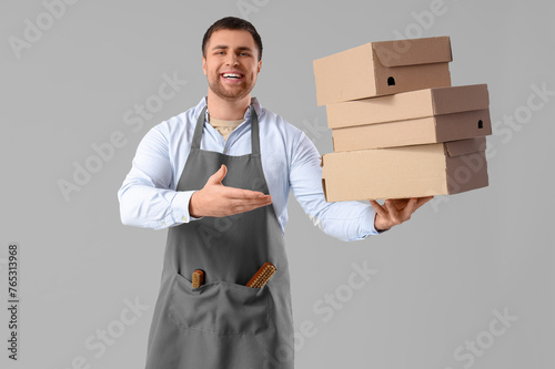 Male shoemaker with shoe bo...