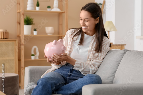 Pretty young woman with pig...