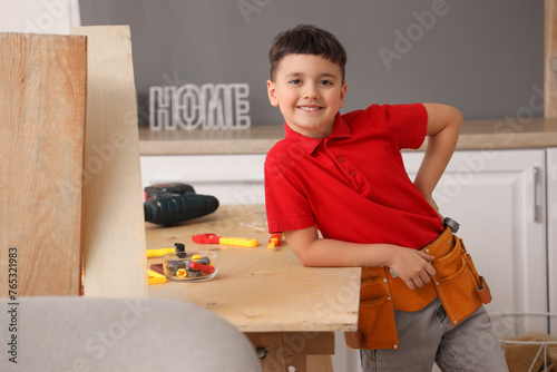 Cute little builder at tabl...