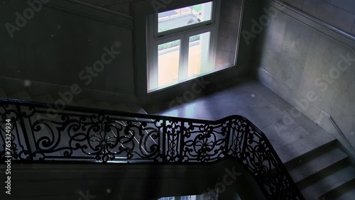 Old Staircase Interior with Natural Light Coming From a Window. 4K Resolution. photo
