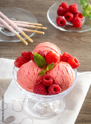 Raspberry ice cream in the bowl.