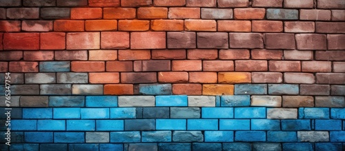 A rectangular brown brick wall with a rainbow of colors painted on it, showcasing a beautiful blend of art and building material