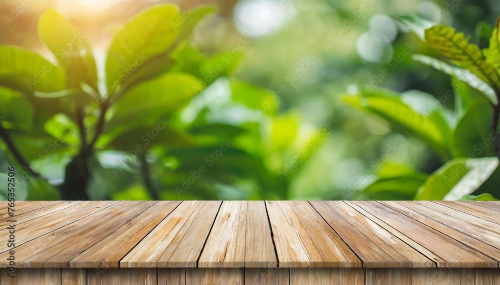 real wood table top texture on blur leaf tree garden background