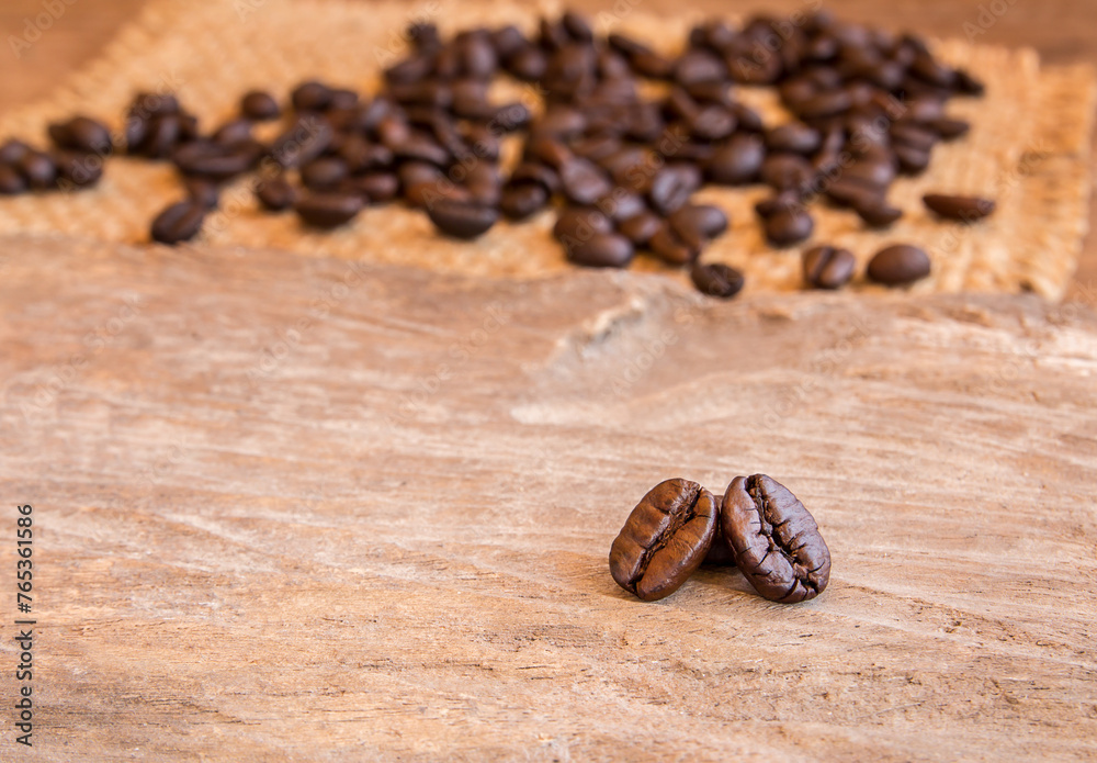 Fototapeta premium Coffee beans on wooden table background