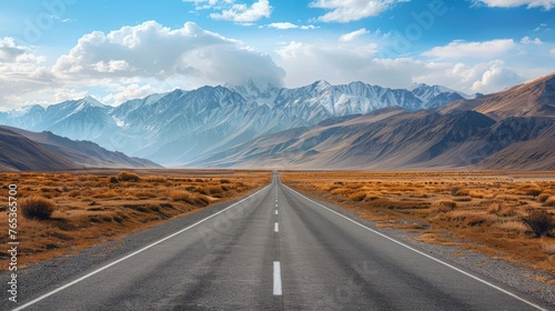 A road leading towards a distant mountain range, symbolizing the ambitious goals and aspirations of startups